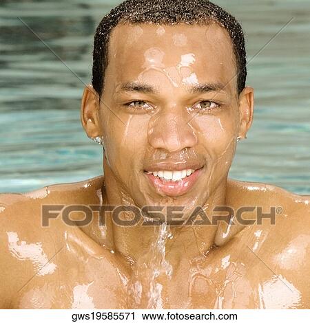 Portrait of a young man in a swimming pool View Large Photo Image Stock Image - Portrait of a young man in a swimming pool. Fotosearch