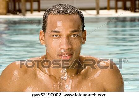 Portrait of a young man in a swimming pool View Large Photo Image Stock Image - Portrait of a young man in a swimming pool. Fotosearch