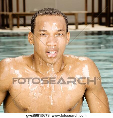 Portrait of a young man in a swimming pool View Large Photo Image Stock Image - Portrait of a young man in a swimming pool. Fotosearch