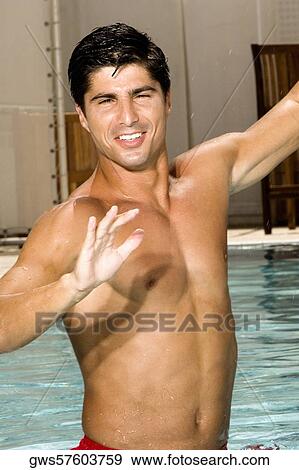 Portrait of a young man in a swimming pool View Large Photo Image Stock Photo - Portrait of a young man in a swimming pool. Fotosearch