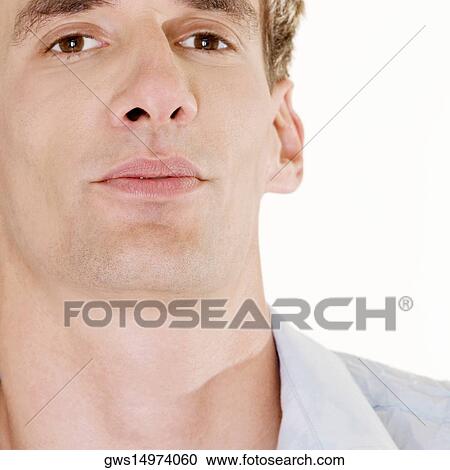 Portrait of a young man looking serious View Large Photo Image Stock Image - Portrait of a young man looking serious. Fotosearch