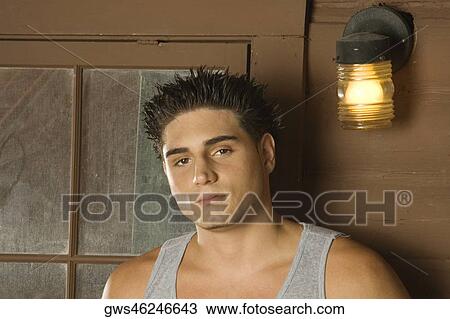 Portrait of a young man looking serious View Large Photo Image Stock Image - Portrait of a young man looking serious. Fotosearch
