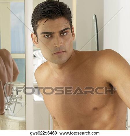 Portrait of a young man looking serious View Large Photo Image Stock Photo - Portrait of a young man looking serious. Fotosearch