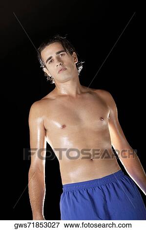 Portrait of a young man looking serious View Large Photo Image Stock Photo - Portrait of a young man looking serious. Fotosearch