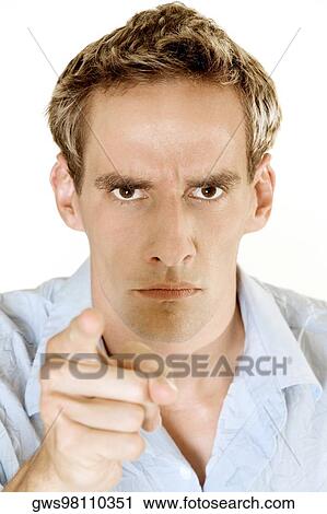 Portrait of a young man pointing forward View Large Photo Image Stock Image - Portrait of a young man pointing forward. Fotosearch