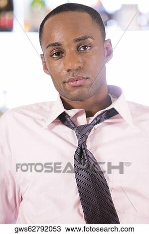 Portrait of a young man relaxing View Large Photo Image Stock Image - Portrait of a young man relaxing. Fotosearch