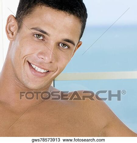 Portrait of a young man smiling View Large Photo Image Stock Image - Portrait of a young man smiling. Fotosearch