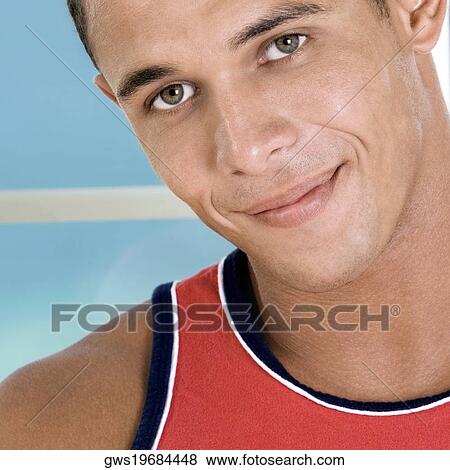 Portrait of a young man smiling View Large Photo Image Stock Photo - Portrait of a young man smiling. Fotosearch