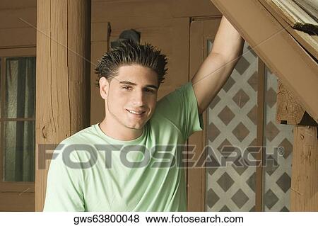 Stock Photo - Portrait of a young man smiling. Fotosearch