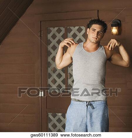 Portrait of a young man stretching his arms View Large Photo Image Stock Photo - Portrait of a young man stretching his arms. Fotosearch