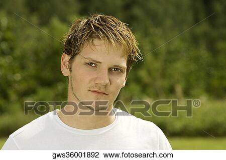 Portrait of a young man thinking View Large Photo Image Stock Image - Portrait of a young man thinking. Fotosearch