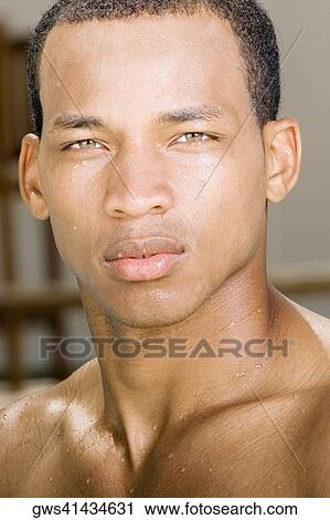 Stock Image - Portrait of a young man thinking. Fotosearch