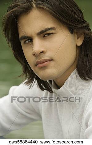 Stock Image - Portrait of a young man thinking. Fotosearch