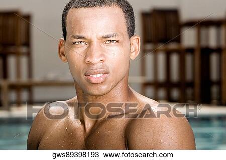 Stock Image - Portrait of a young man thinking. Fotosearch