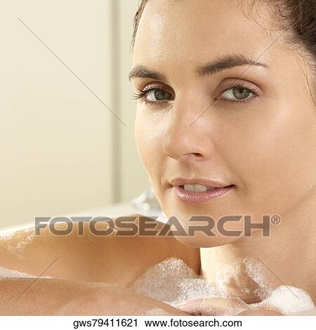 Portrait of a young woman in the bathroom View Large Photo Image Stock Image - Portrait of a young woman in the bathroom. Fotosearch