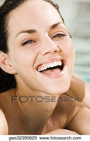Portrait of a young woman laughing View Large Photo Image Stock Photo - Portrait of a young woman laughing. Fotosearch