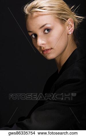 Portrait of a young woman looking serious View Large Photo Image Picture - Portrait of a young woman looking serious. Fotosearch