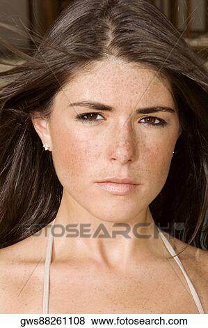 Portrait of a young woman looking serious View Large Photo Image Stock Photo - Portrait of a young woman looking serious. Fotosearch