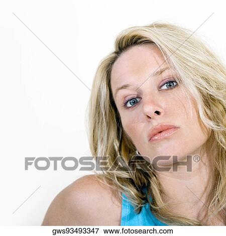 Portrait of a young woman looking serious View Large Photo Image Stock Photo - Portrait of a young woman looking serious. Fotosearch