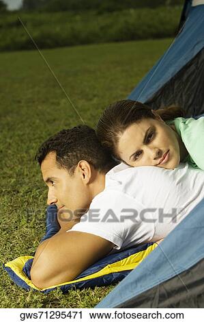 Portrait of a young woman lying on the back of a young man View Large Photo Image Stock Image - Portrait of a young woman lying on the back of a young man. Fotosearch