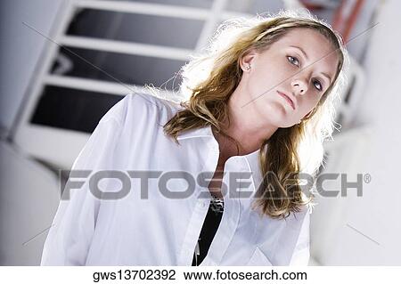 Portrait of a young woman posing View Large Photo Image Stock Image - Portrait of a young woman posing. Fotosearch