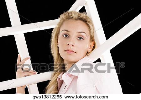 Portrait of a young woman posing View Large Photo Image Stock Photography - Portrait of a young woman posing. Fotosearch