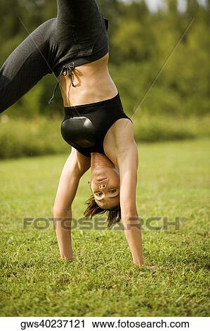 Portrait of a young woman practicing martial arts View Large Photo Image Stock Image - Portrait of a young woman practicing martial arts. Fotosearch