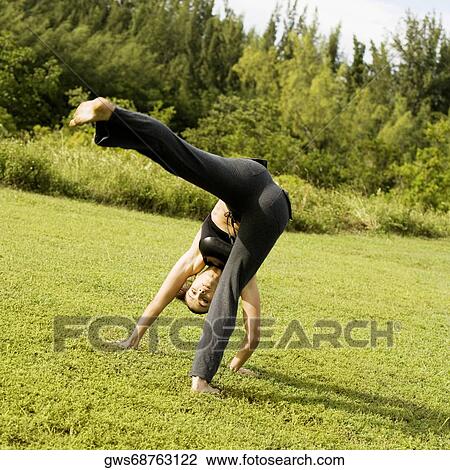 Portrait of a young woman practicing martial arts View Large Photo Image Stock Image - Portrait of a young woman practicing martial arts. Fotosearch