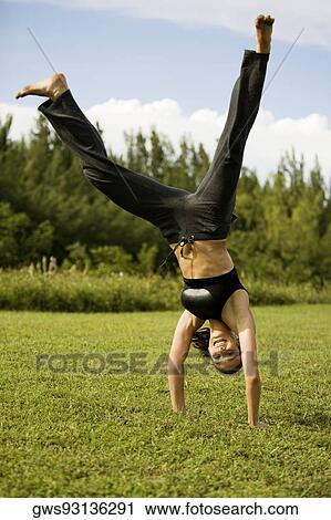 Portrait of a young woman practicing martial arts View Large Photo Image Stock Image - Portrait of a young woman practicing martial arts. Fotosearch