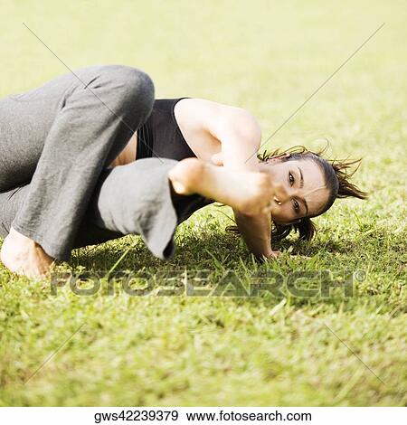 Portrait of a young woman practicing martial arts View Large Photo Image Stock Photo - Portrait of a young woman practicing martial arts. Fotosearch
