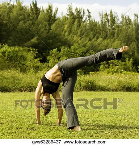Portrait of a young woman practicing martial arts View Large Photo Image Stock Photo - Portrait of a young woman practicing martial arts. Fotosearch
