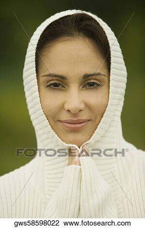 Portrait of a young woman smiling in a prayer position View Large Photo Image Stock Image - Portrait of a young woman smiling in a prayer position. Fotosearch