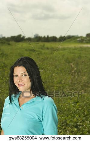 Portrait of a young woman smiling View Large Photo Image Picture - Portrait of a young woman smiling. Fotosearch