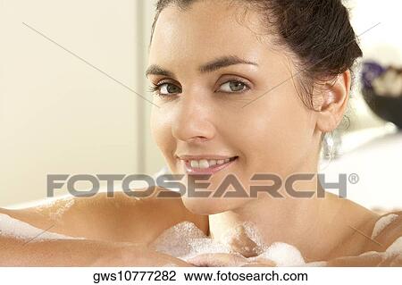Portrait of a young woman smiling View Large Photo Image Stock Image - Portrait of a young woman smiling. Fotosearch