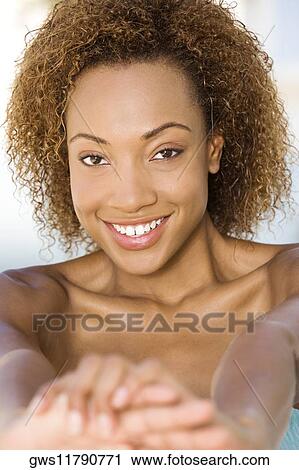 Portrait of a young woman smiling View Large Photo Image Stock Image - Portrait of a young woman smiling. Fotosearch