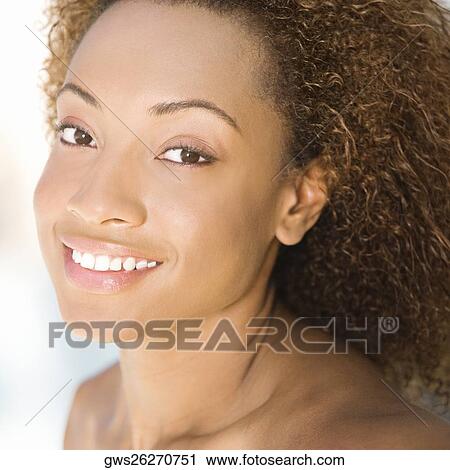 Portrait of a young woman smiling View Large Photo Image Stock Image - Portrait of a young woman smiling. Fotosearch