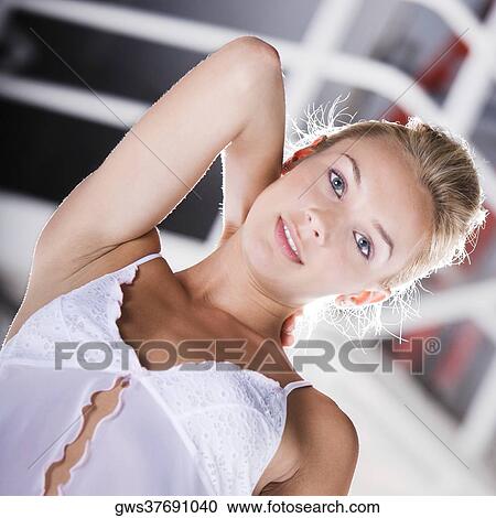 Portrait of a young woman smiling View Large Photo Image Stock Image - Portrait of a young woman smiling. Fotosearch