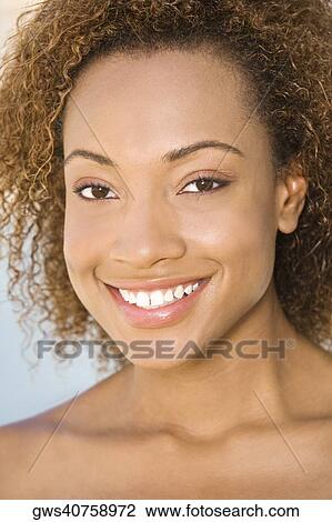 Portrait of a young woman smiling View Large Photo Image Stock Image - Portrait of a young woman smiling. Fotosearch