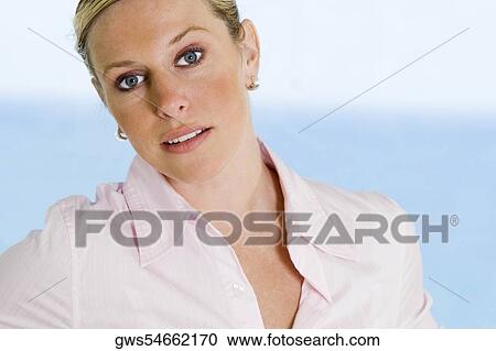 Portrait of a young woman smiling View Large Photo Image Stock Image - Portrait of a young woman smiling. Fotosearch