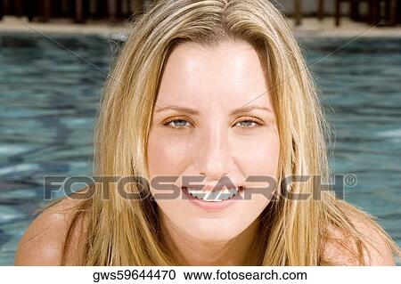 Portrait of a young woman smiling View Large Photo Image Stock Image - Portrait of a young woman smiling. Fotosearch