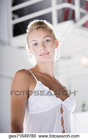 Portrait of a young woman smiling View Large Photo Image Stock Image - Portrait of a young woman smiling. Fotosearch