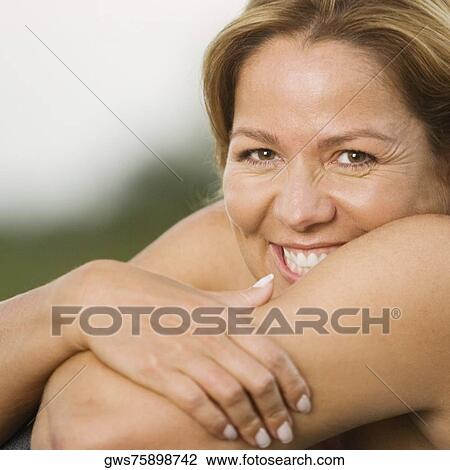 Portrait of a young woman smiling View Large Photo Image Stock Image - Portrait of a young woman smiling. Fotosearch