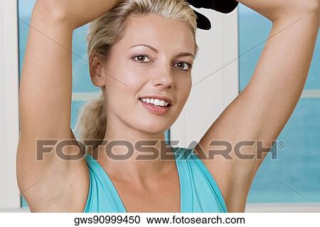 Portrait of a young woman smiling View Large Photo Image Stock Image - Portrait of a young woman smiling. Fotosearch