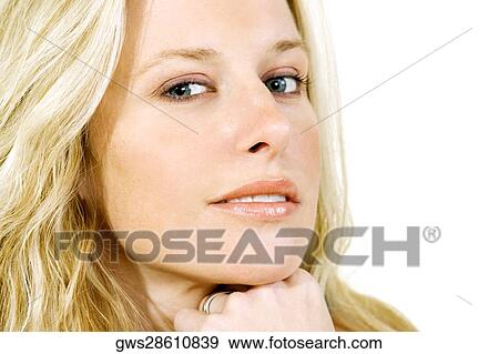 Portrait of a young woman smiling View Large Photo Image Stock Photo - Portrait of a young woman smiling. Fotosearch