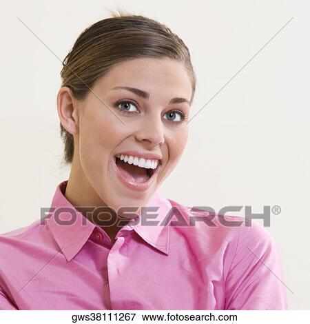 Portrait of a young woman smiling View Large Photo Image Stock Photo - Portrait of a young woman smiling. Fotosearch