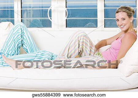 Stock Photo - Portrait of a young woman smiling. Fotosearch