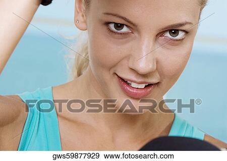 Stock Photo - Portrait of a young woman smiling. Fotosearch