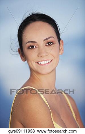 Portrait of a young woman smiling View Large Photo Image Stock Photo - Portrait of a young woman smiling. Fotosearch