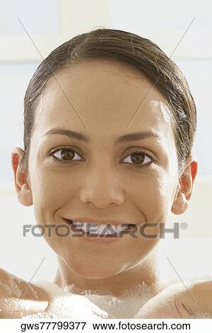 Stock Photo - Portrait of a young woman smiling. Fotosearch