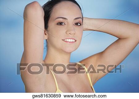 Portrait of a young woman smiling View Large Photo Image Stock Photo - Portrait of a young woman smiling. Fotosearch
